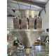 1569 - Doypack avec peseuse 4 couloirs vibrants